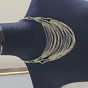 Layered metal necklace with extender